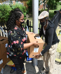 A food insecure person is recieving food from food pantry